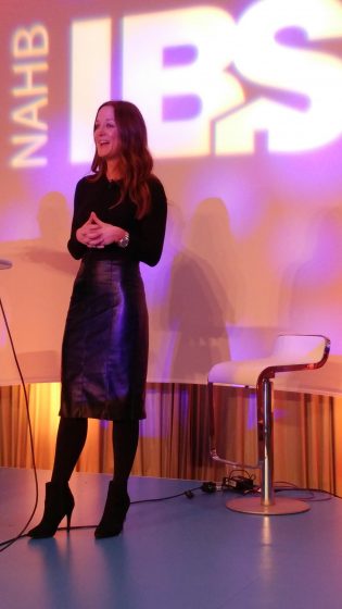 Megan on stage and presenting at IBS 2018